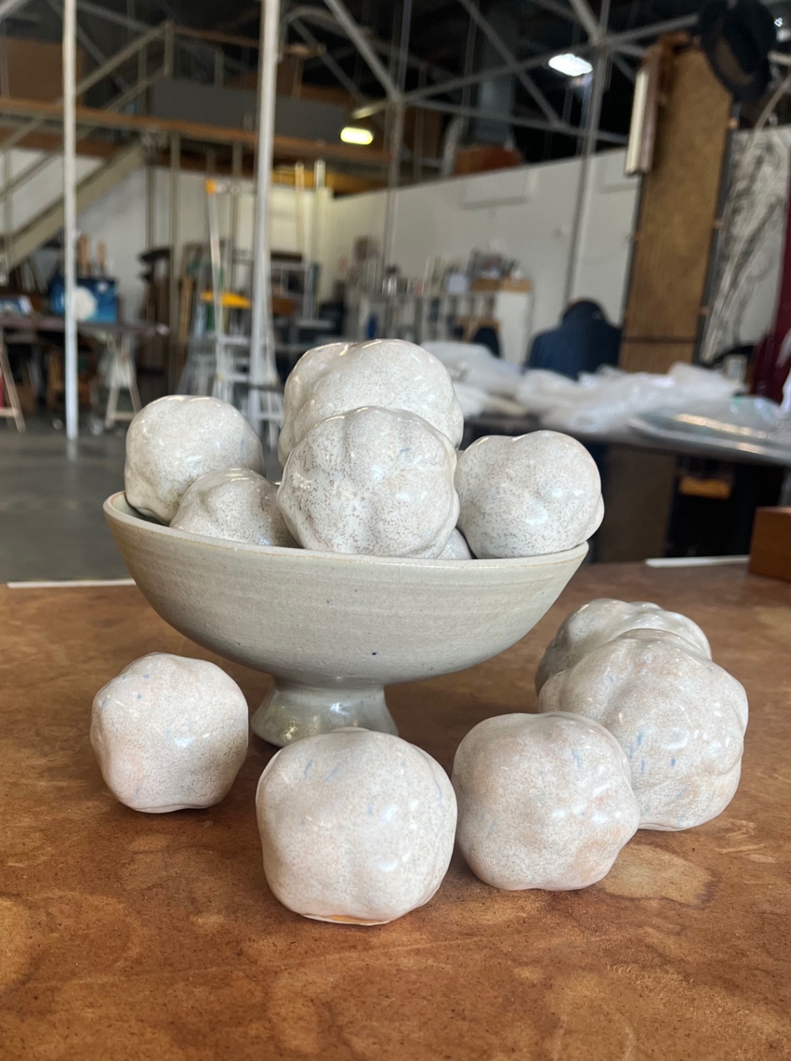 Lobulated ball mode of ceramic stoneware and glazed with a semi matte cinnamon glaze